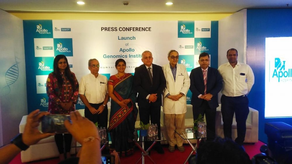  A group of people stand on a stage at a press conference to announce the launch of a partnership between Google AI and Apollo Hospitals to bring advanced healthcare to India.